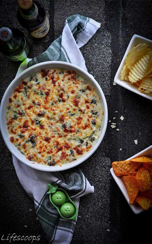 This decadent Baked 3 Cheese Spinach and Artichoke Dip recipe is loaded with three cheeses and baked to bubbly perfection. It always leaves my guests begging for more after scraping the bowl clean.